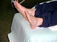 A rescue worker receives foot acupuncture.