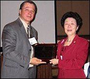 Doreen Chen with award and Gene Bruno.