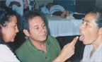 Della Estrada instructs one of the local doctors on tongue diagnosis.