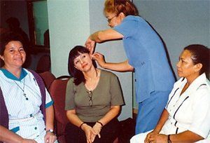 Participating doctors and nurses practice the NADA five-needle protocol.