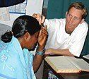 Brett Bloomberg conducts a patient intake at Ananda Nagar.
