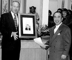 Jack Knight presents an engraved plaque to Emeritus Shuji Goto.